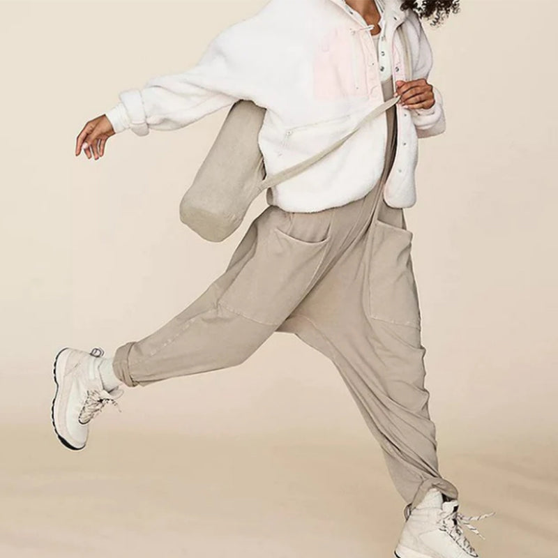 Mono de Color sólido con escote en V y bolsillo tipo saco.