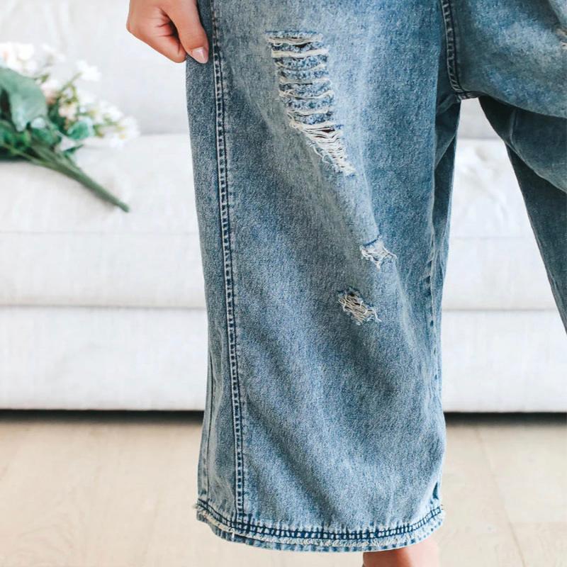 Loose fit distressed denim jumpsuit