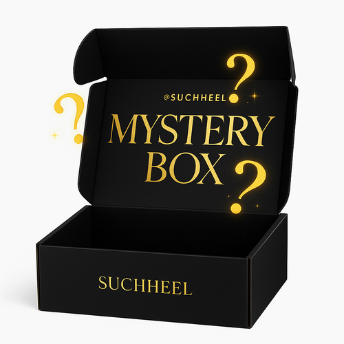 Black mystery box with gold text and question marks, featuring the brand 'SUCHHEEL'.