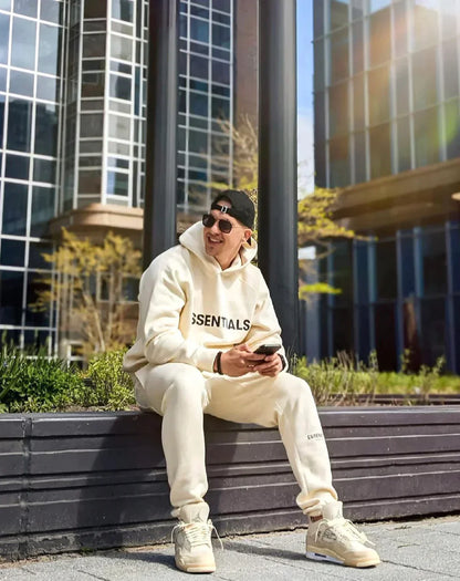 SUDADERA CON CAPUCHA ESENCIAL